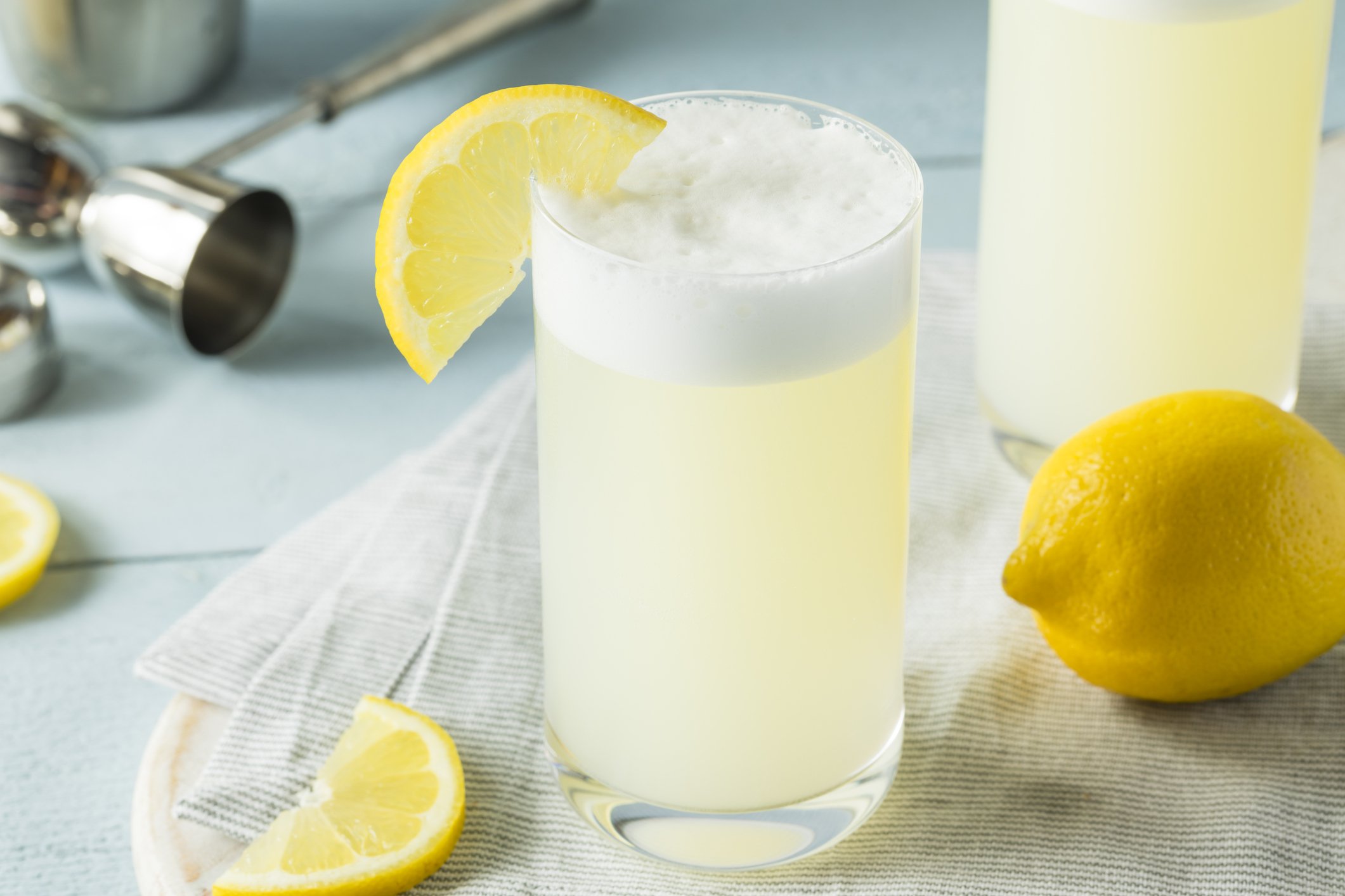 Refreshing Cold Egg Gin Fizz with a Lemon Garnish Refreshing Cold Egg Gin Fizz with a Lemon Garnish