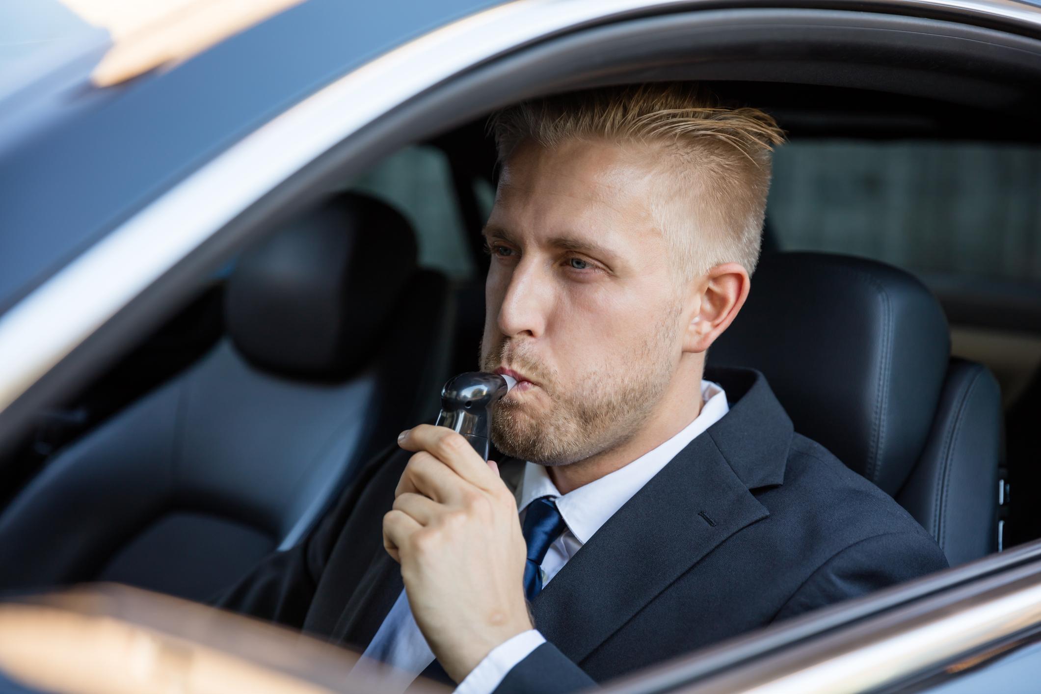 Man Taking Alcohol Test Man Taking Alcohol Test