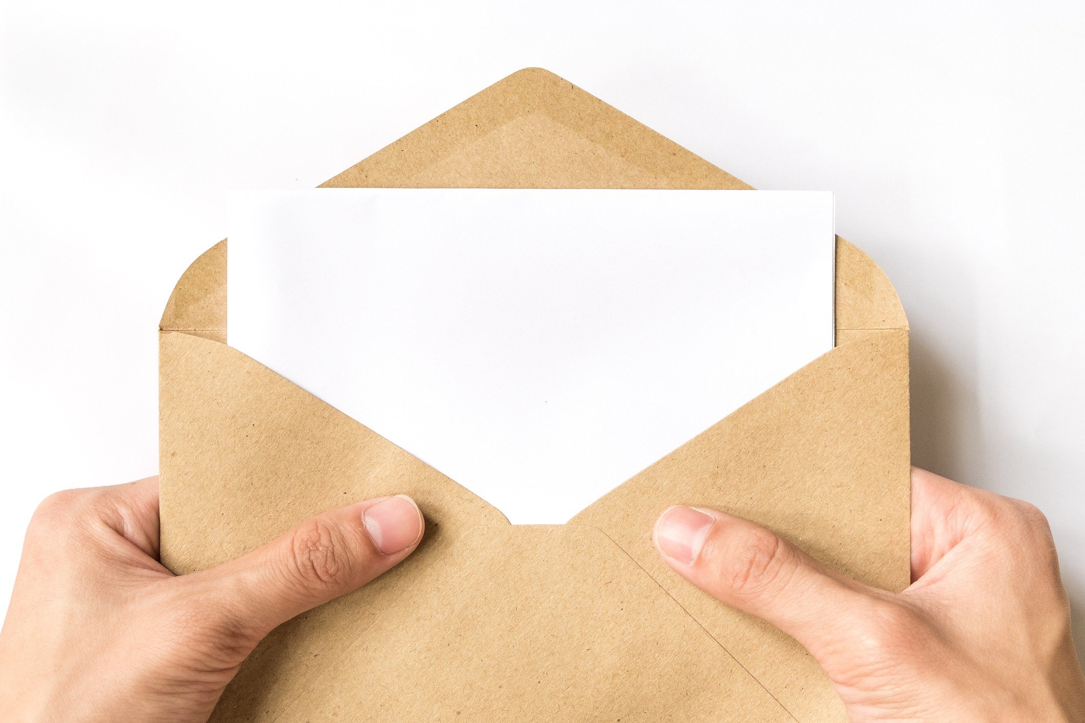 hand opening brown Envelope on white background hand opening brown Envelope on white background
