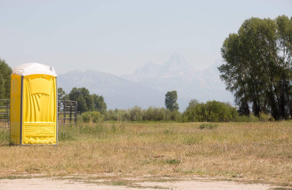 a port-o-potty in a field a port-o-potty in a field