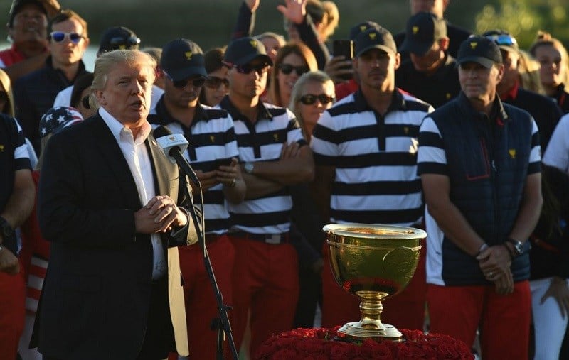 US President Donald Trump speaks during the trophy presentation of the Presidents Cup golf championship at Liberty National Golf Club in Jersey City, New Jersey, after the United States clinched their 10th Presidents Cup on October 1, 2017. Trump arrived at the club -- some 30 miles from his home at his Trump National Bedminster resort -- just in time to see a US team described by International captain Nick Price as a "juggernaut" seal the win.