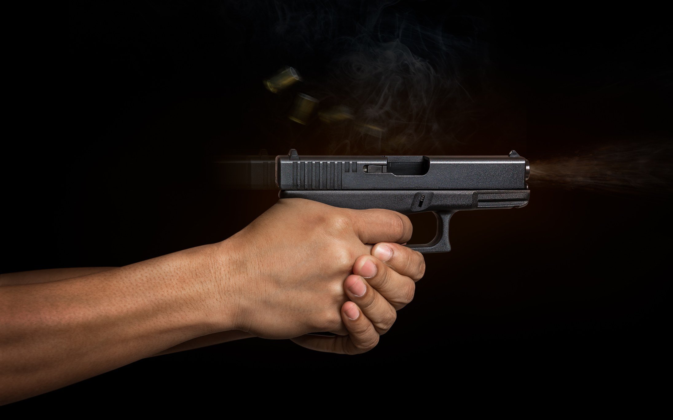 A hand firing a weapon.