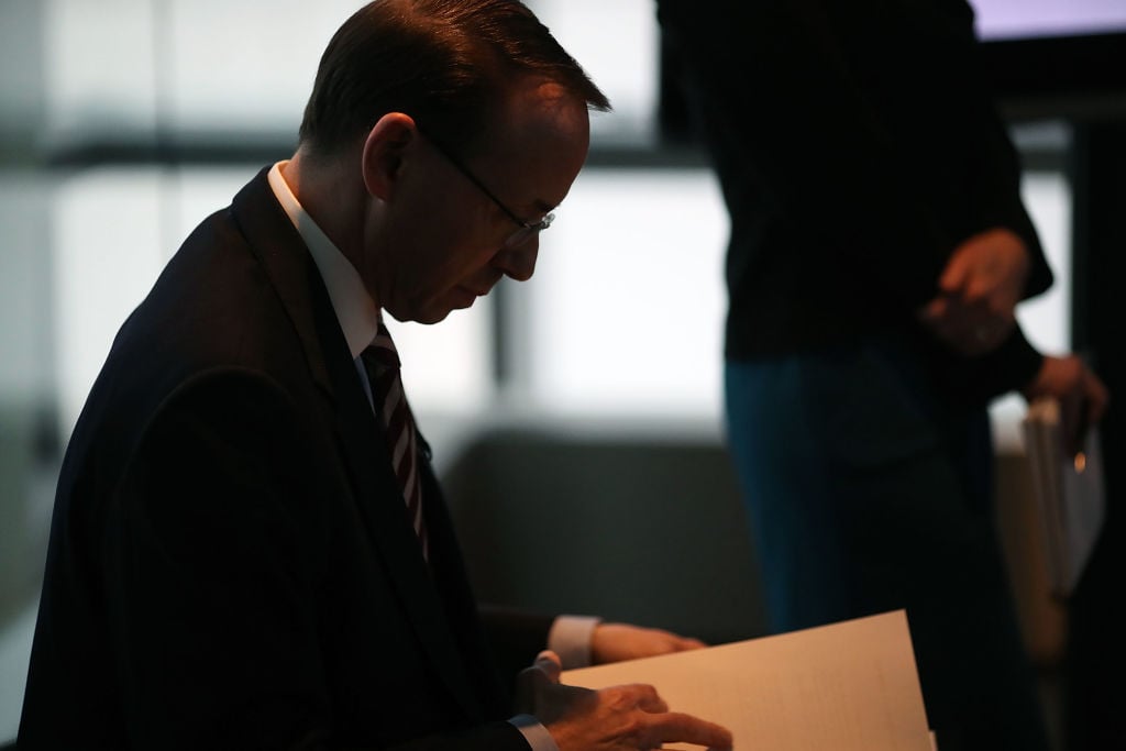 rod rosenstein looks over a stack of papers in profile rod rosenstein looks over a stack of papers in profile