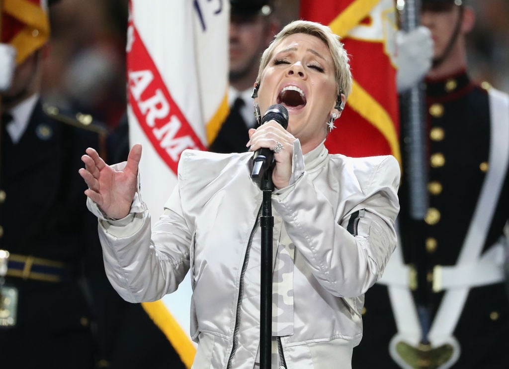 Pink sings the national anthem prior to Super Bowl LII between the New England Patriots and the Philadelphia Eagles at U.S. Bank Stadium on February 4, 2018 in Minneapolis, Minnesota. Pink sings the national anthem prior to Super Bowl LII between the New England Patriots and the Philadelphia Eagles at U.S. Bank Stadium on February 4, 2018 in Minneapolis, Minnesota.