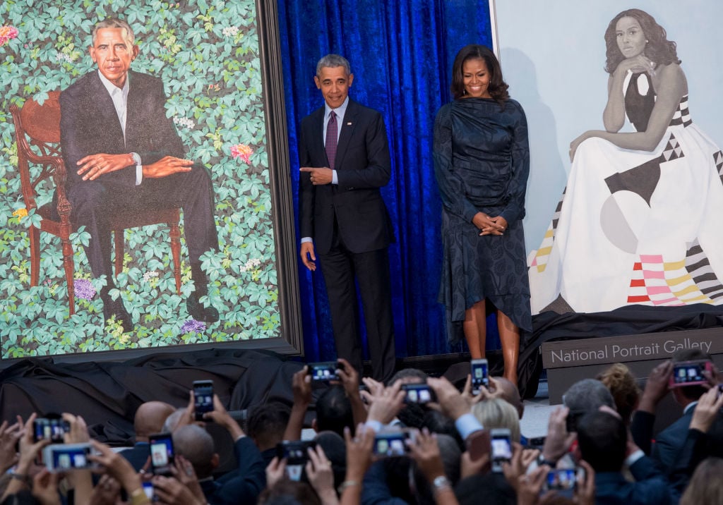 the Obamas with their portraits