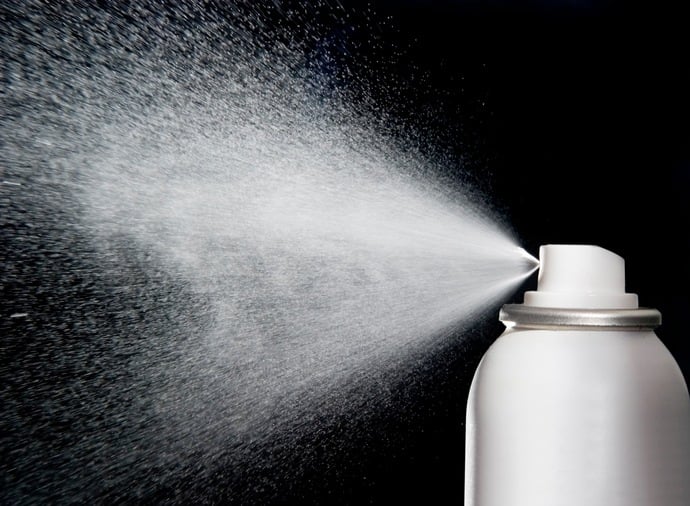 spray aerosol on black background spray aerosol on black background