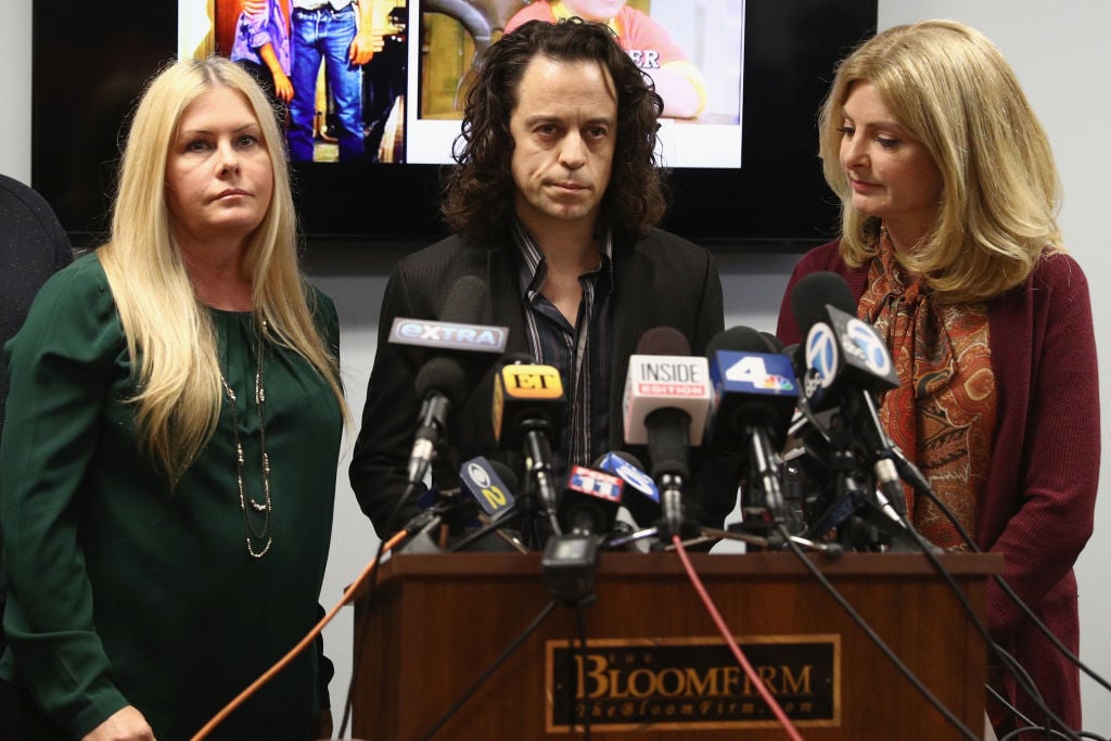 Alexander Polinsky speaks during a press conference with Nicole Eggert (L) and his attorney Lisa Bloom regarding sexual harassment allegations against Scott Baio at The Bloom Firm on February 14, 2018 in Woodland Hills, California. Polinsky is the second person, along with Nicole Eggert, to costarred with Baio in the 1980s sitcom Charles in Charge who have accused him of sexual harassment. Both Polinsky and Eggert were minors at the time. 