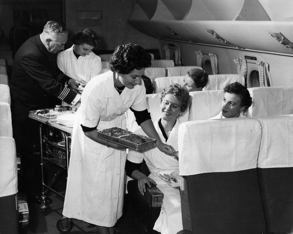 BOAC air hostesses in training are taught in a mock-up of an aircraft cabin at London Airport