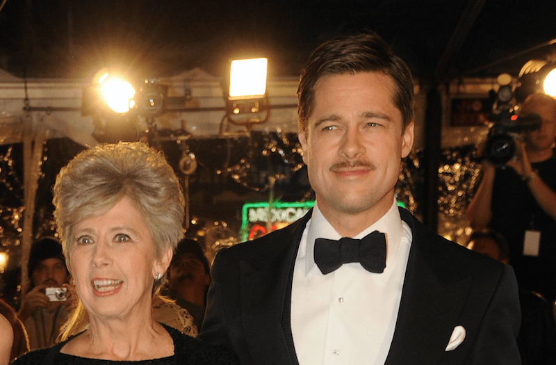 Jane Pitt with Brad, who is smiling and wearing a tuxedo. Jane Pitt with Brad, who is smiling and wearing a tuxedo.