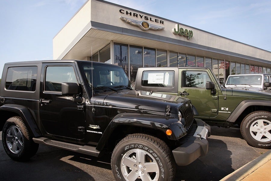 Jeeps built by Chrysler sit on the lot at a dealership