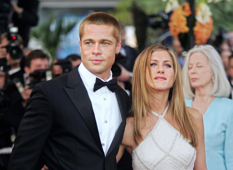 Brad Pitt and Jennifer Aniston on a red carpet. 
