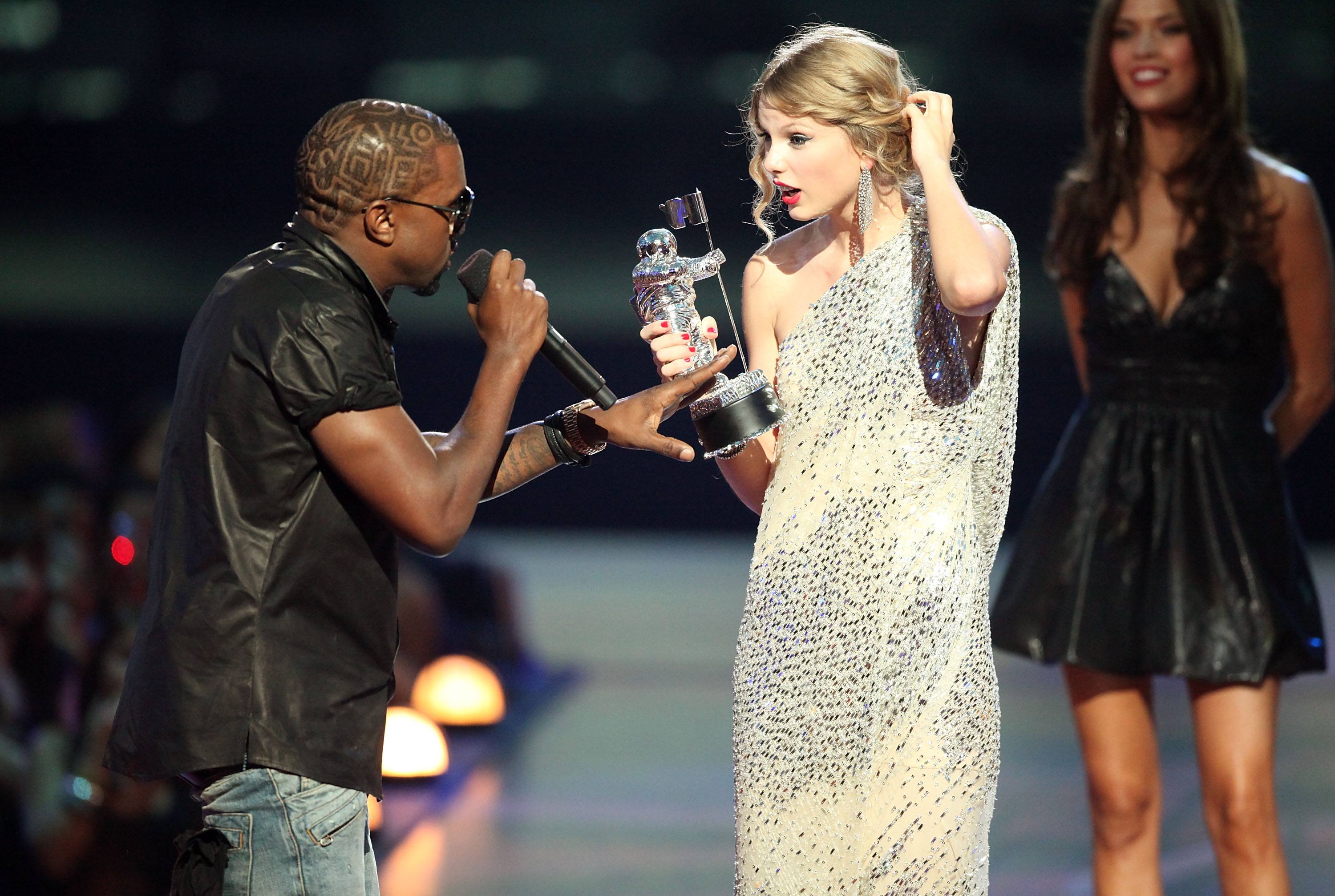 Kanye West and Taylor Swift on stage at the VMAs. 
