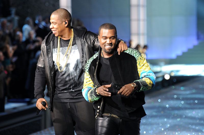 Kanye West and Jay-Z performing on stage. Kanye West and Jay-Z performing on stage.