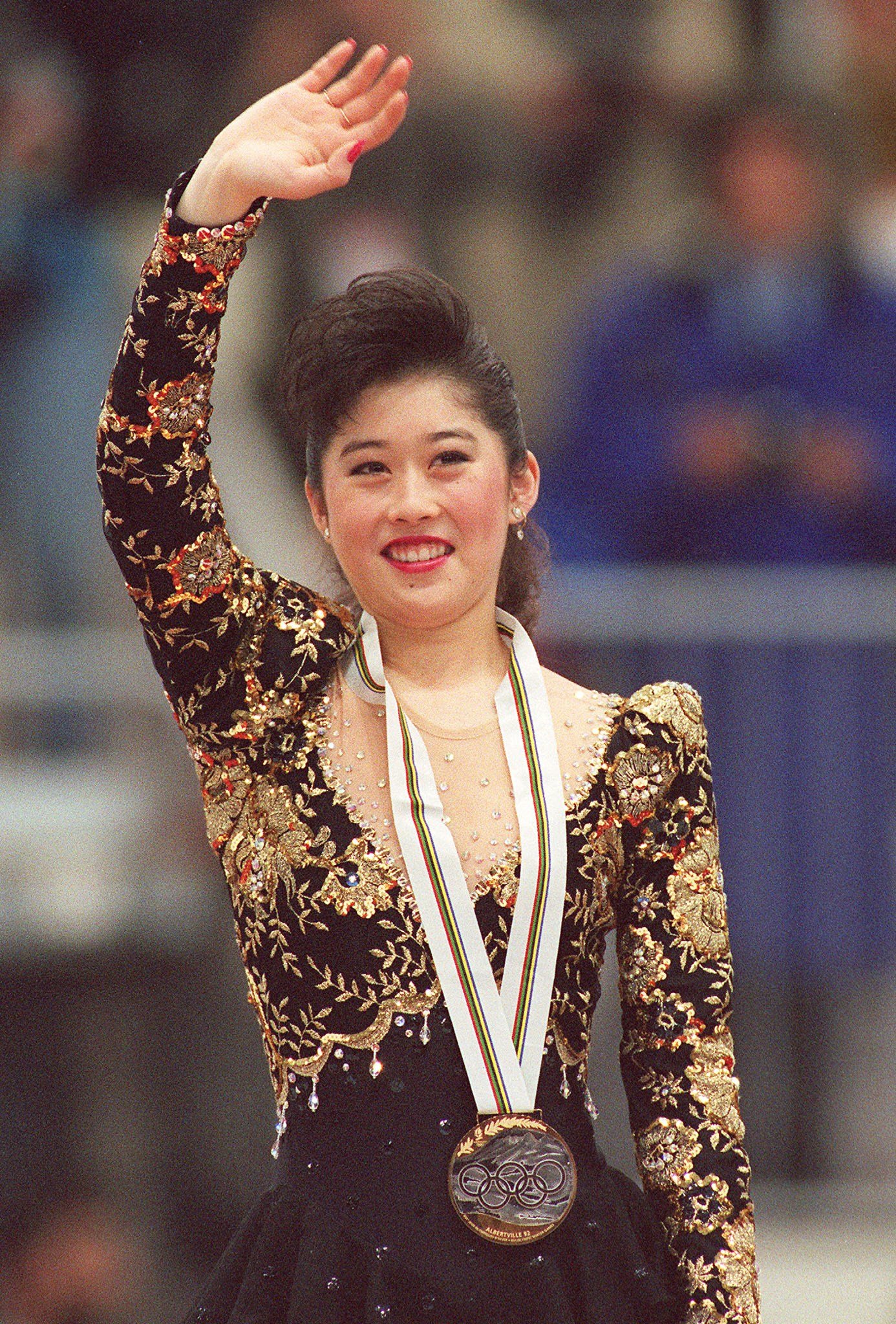 Kristi Yamaguchi receives a medal