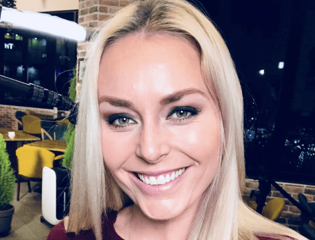 Lindsey Vonn smiling brightly in a restaurant. Lindsey Vonn smiling brightly in a restaurant.