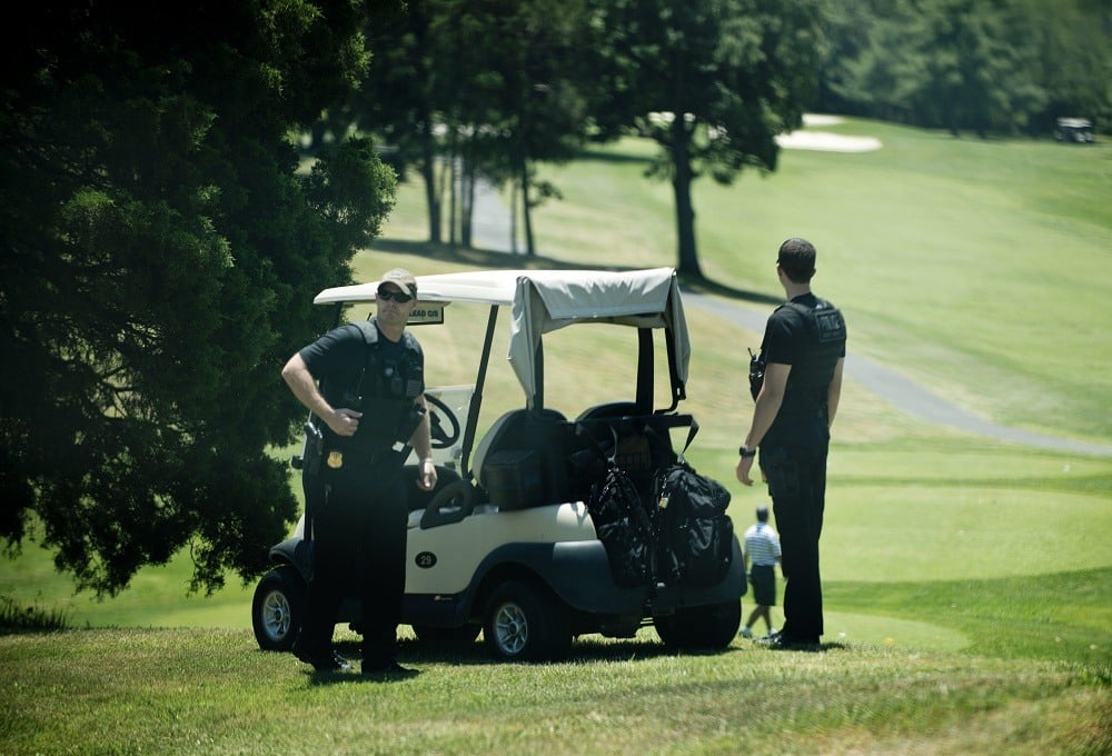 Members of the Secret Service watch over a golf course at Fort Belvoir before US President Barack Obama
