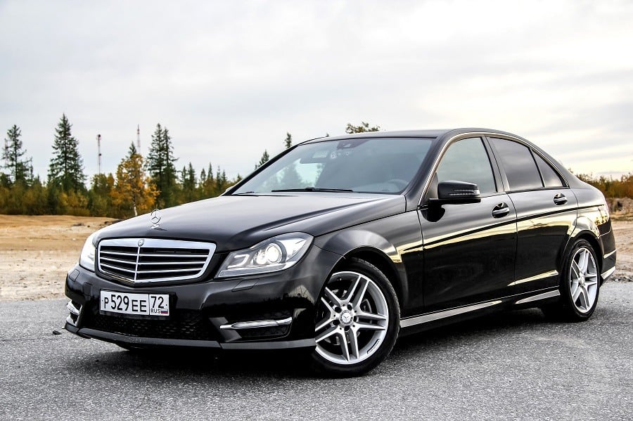 Mercedes-Benz W204 C-class is parked at the countryside.