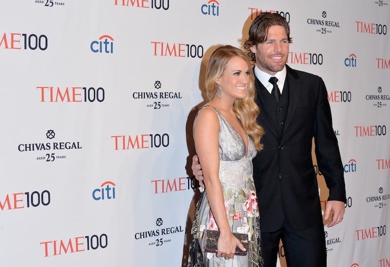 Carrie Underwood posing with Mike Fisher. 