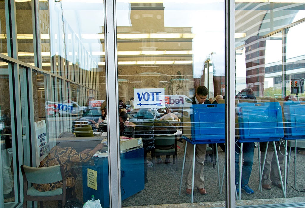 Citizens go to the cast their ballots at the city hall building on election day November 4, 2014 in Milwaukee, Wisconsin