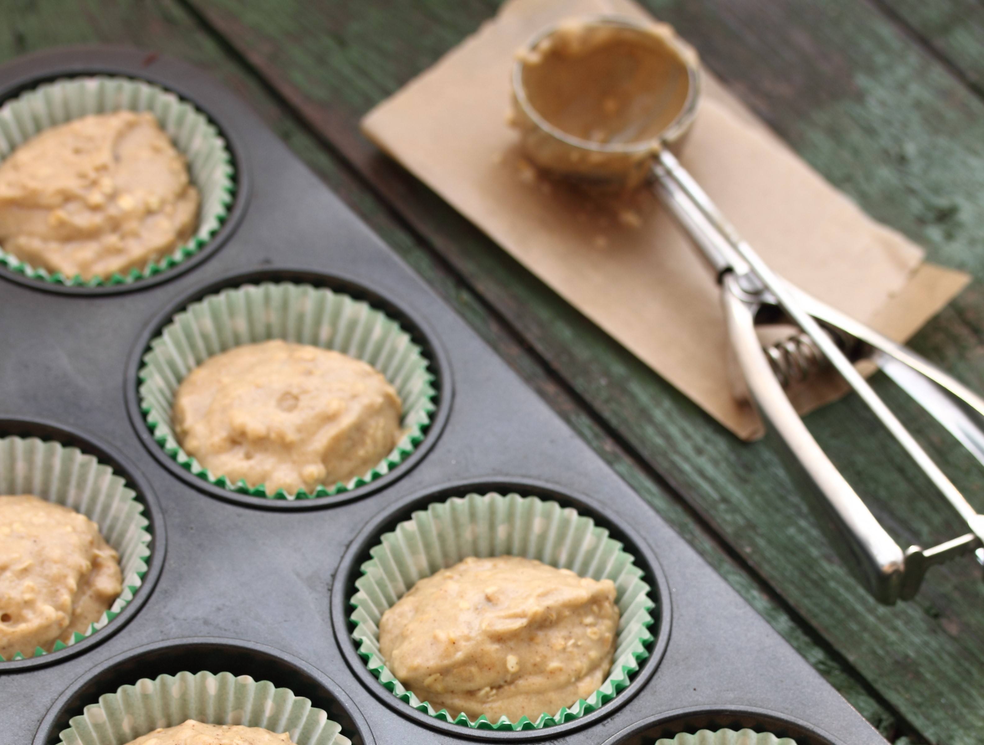 Muffin batter with an ice cream scoop