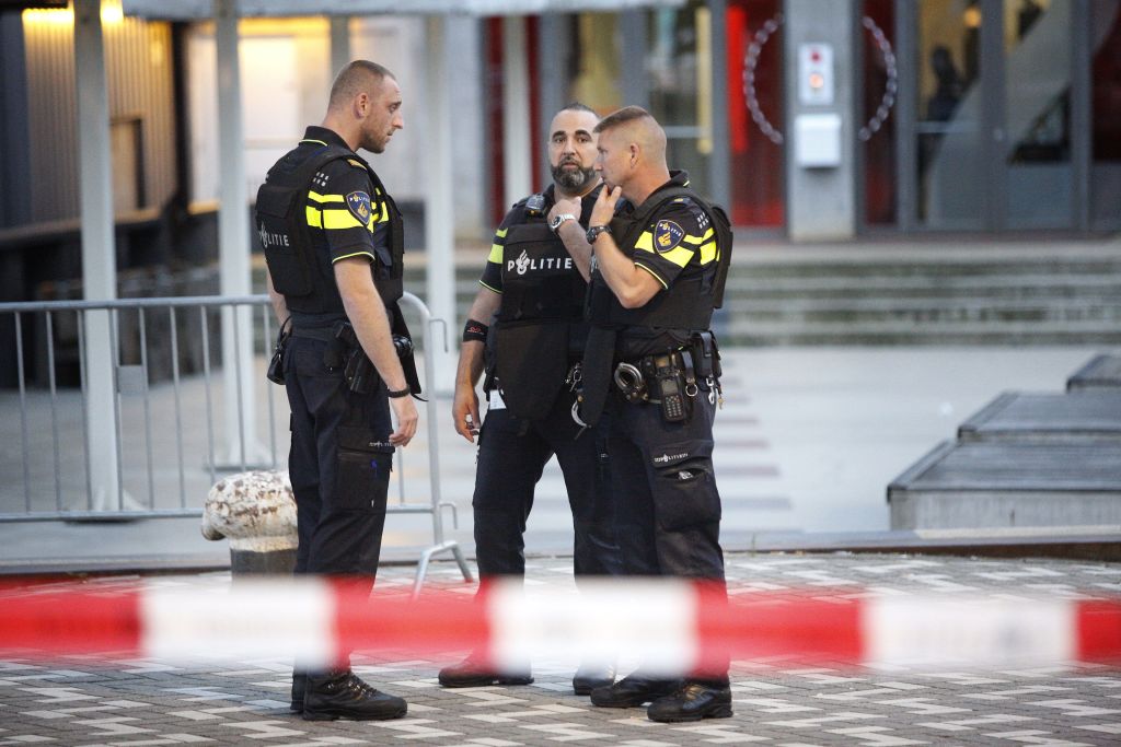 Police stand during the evacuation the Maassilo concert venue