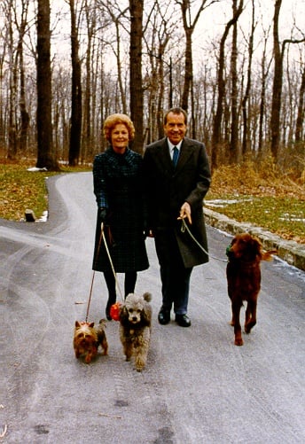 Richard Nixon and his wife walking their dogs