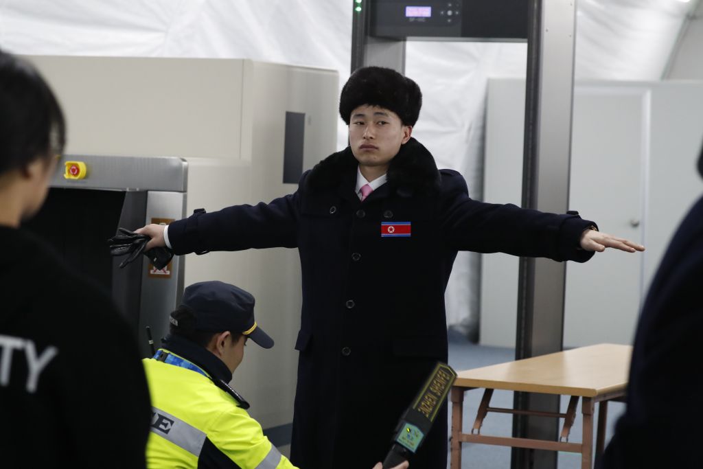North Korean delegate is searched at Olympics