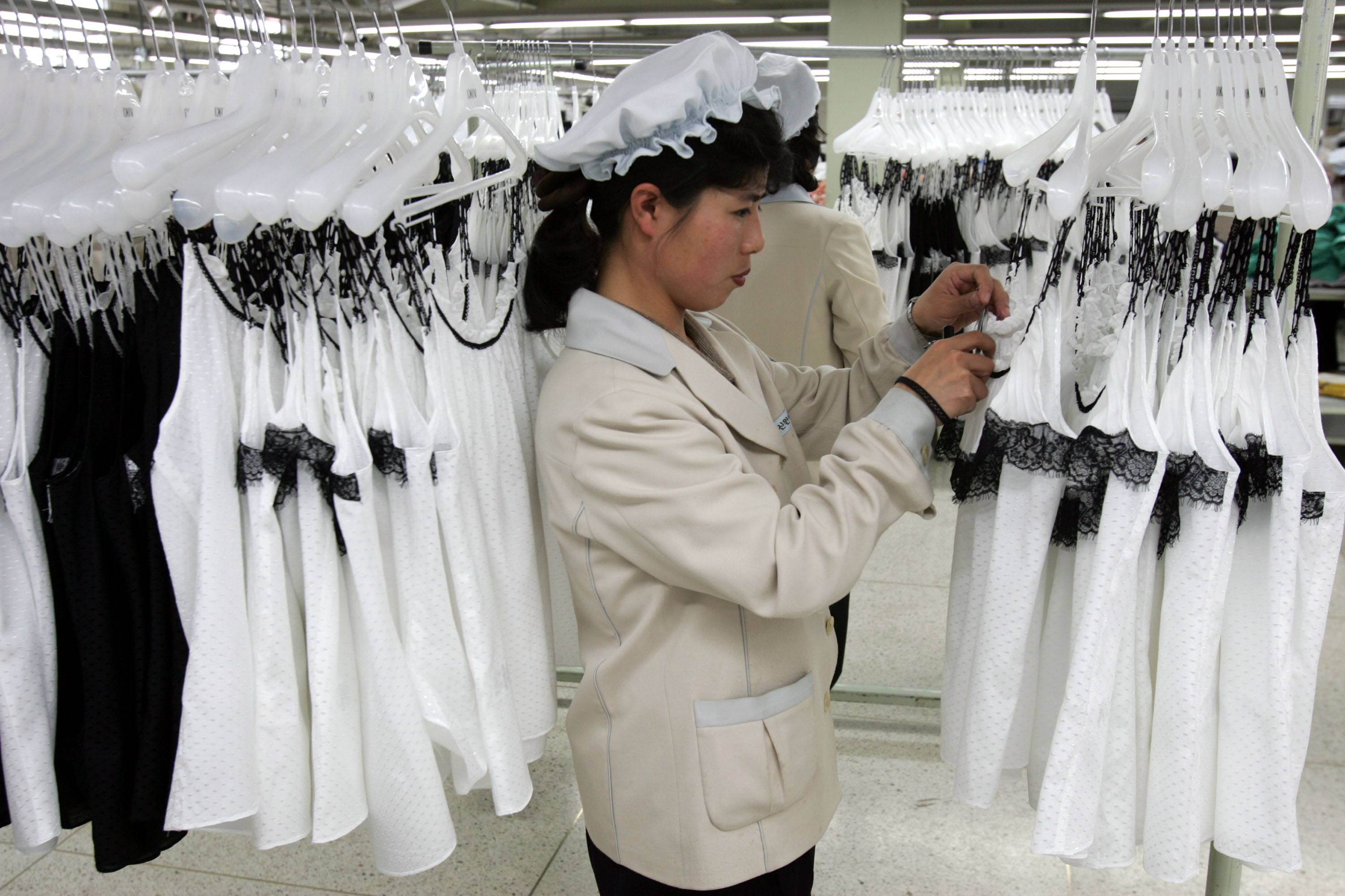 North Korean women work at the assembly line of the factory of South Korean textile company