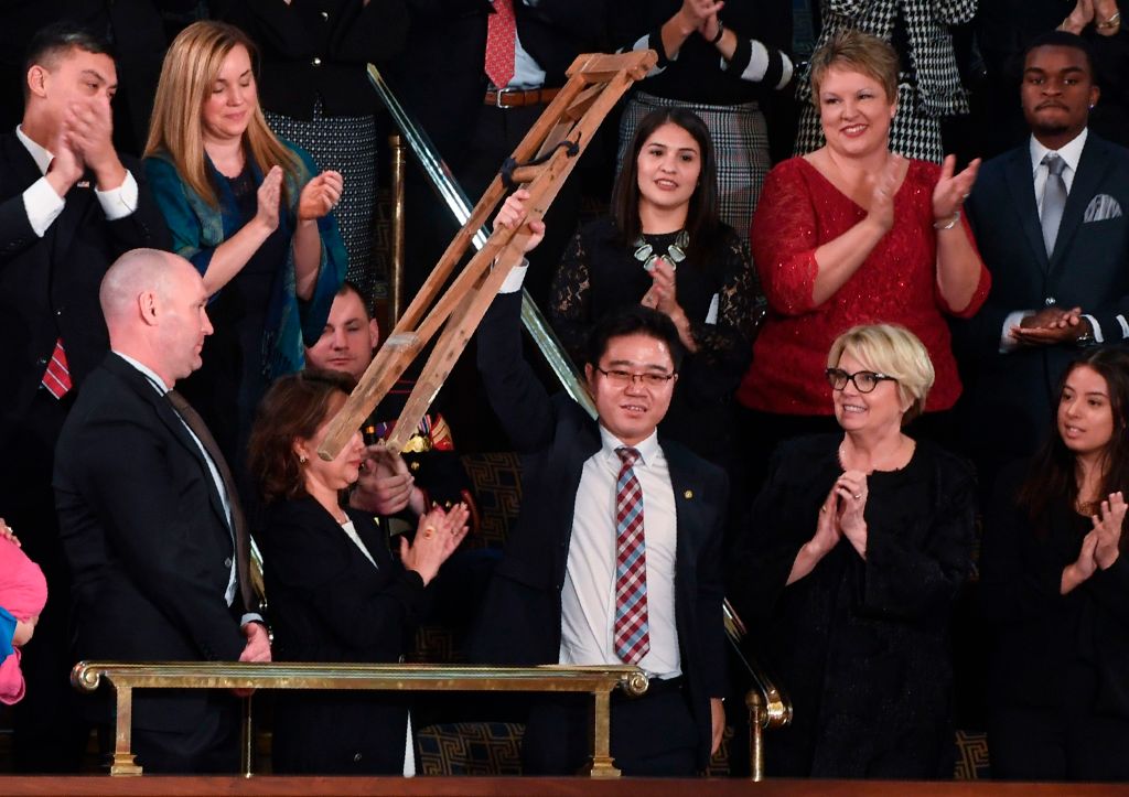 North korean defector raises his crutch at state of the union
