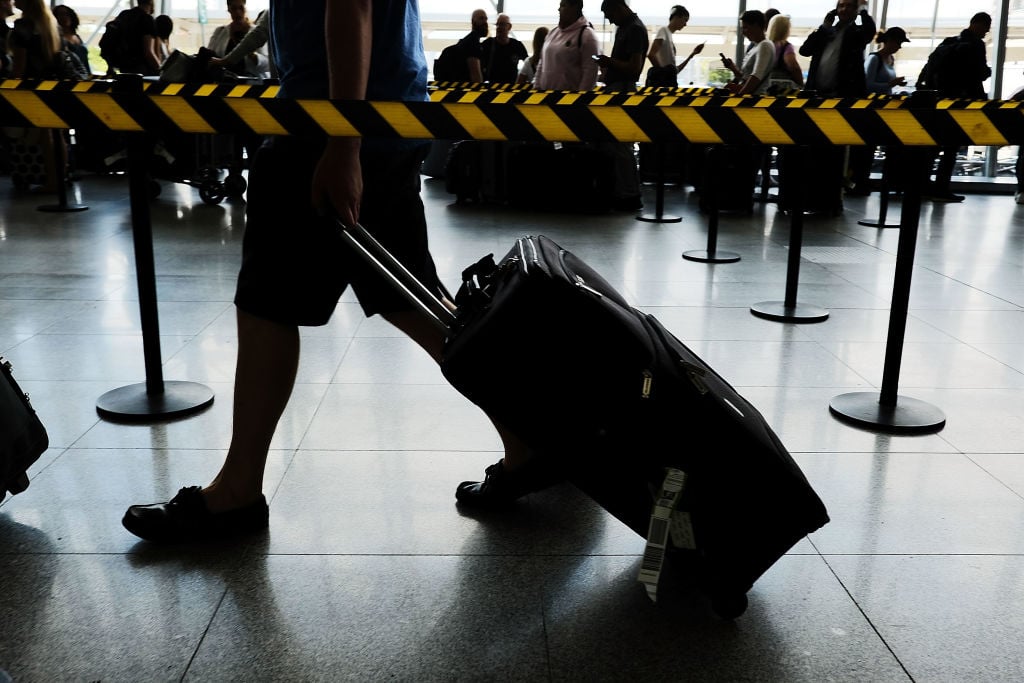People arrive at John F. Kennedy (JFK) international airport