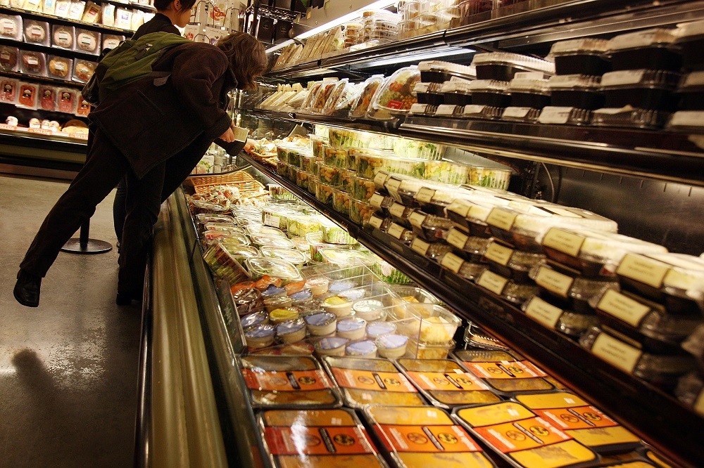 People shop at a Manhattan grocery store