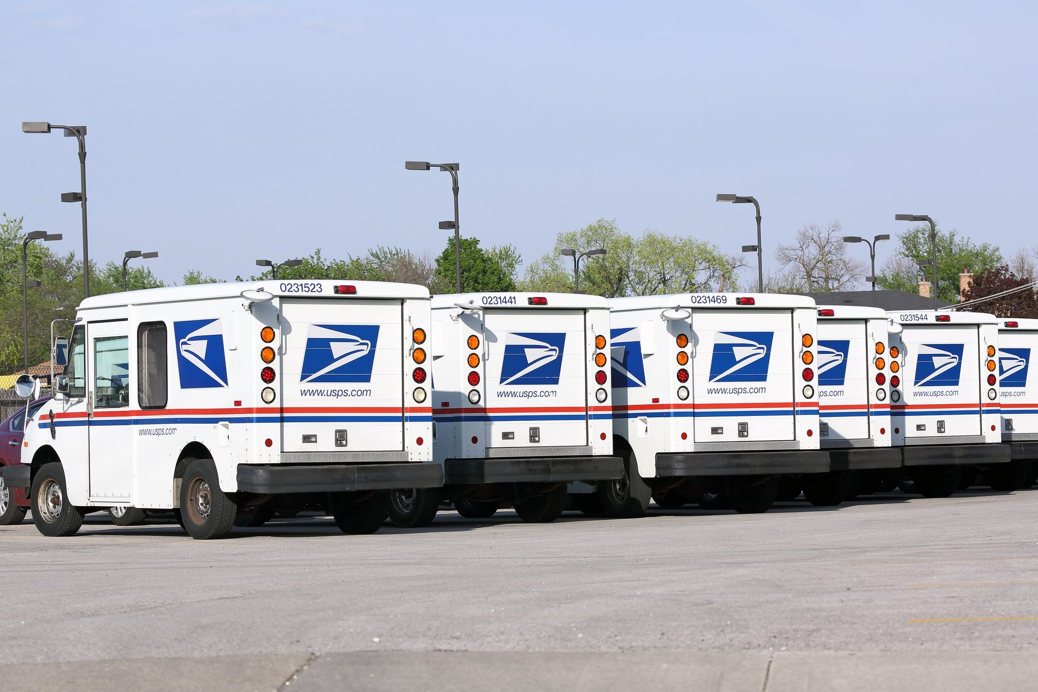 Fleet of USPS mail delivery trucks