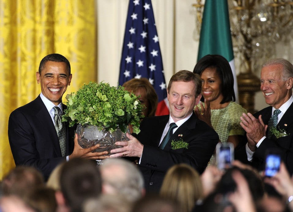 US President Barack Obama accepts a bowl of shamrocks from Irish Prime Minister Enda Kenny