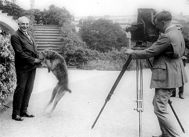 Warren Harding posing with his dog, Laddie