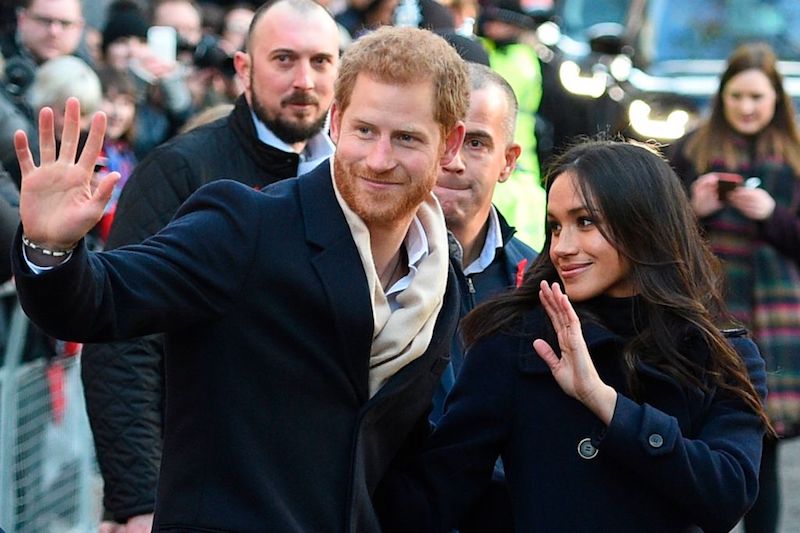 Meghan Markle waving with Prince Harry. Meghan Markle waving with Prince Harry.