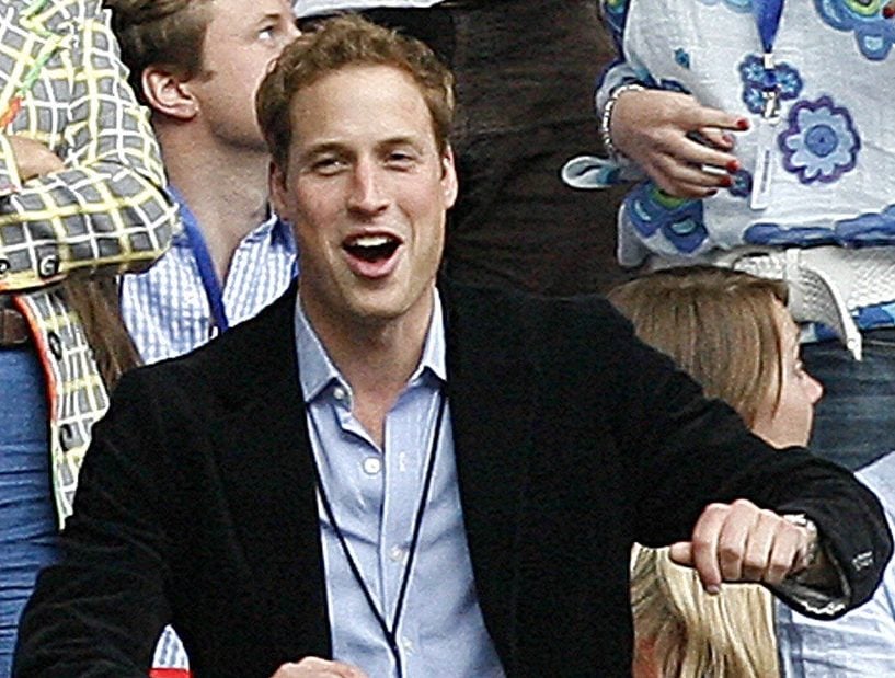 Prince William dances during a performance at Wembley stadium