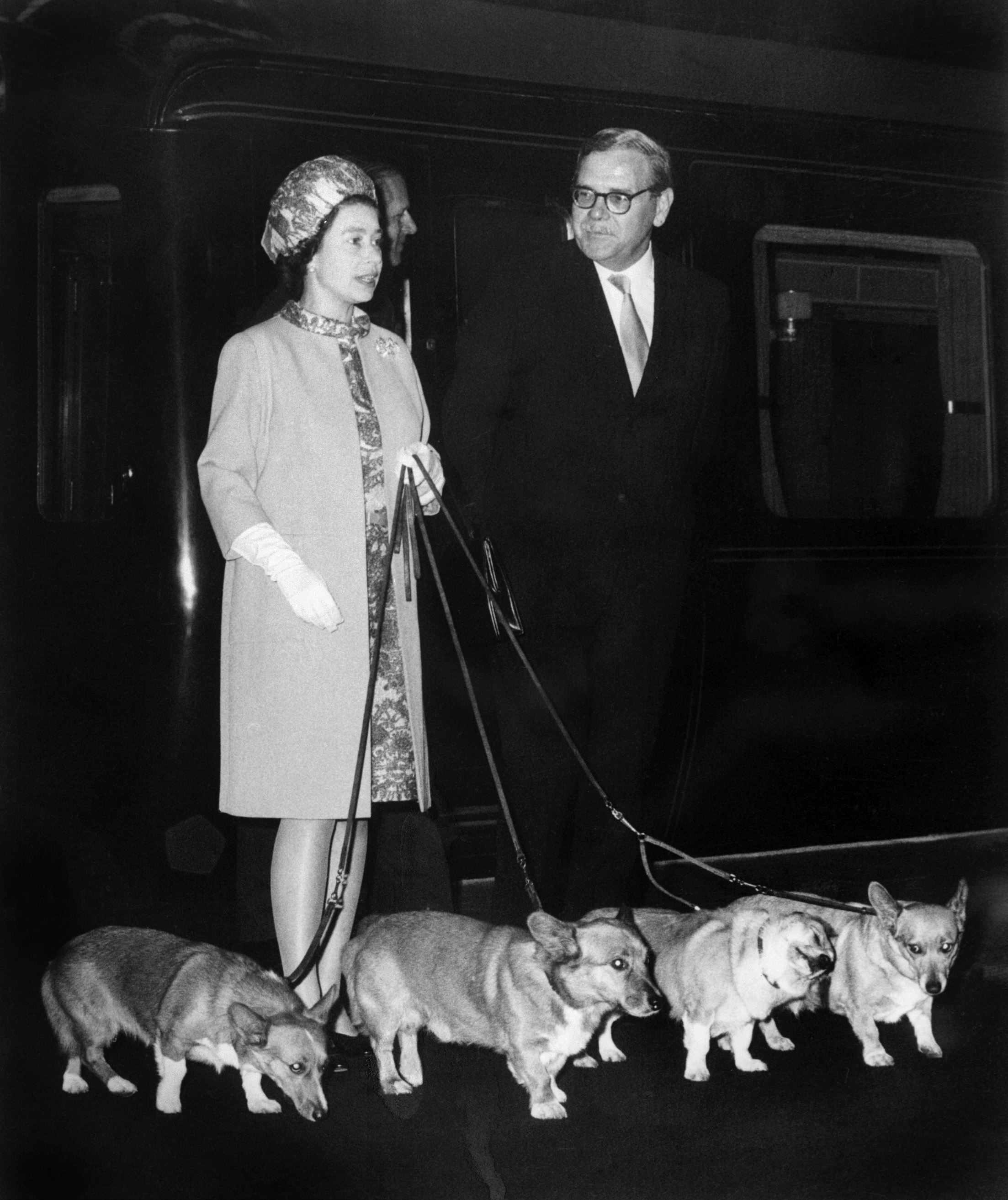 Queen Elizabeth II arrives at King's Cross railway with her corgis