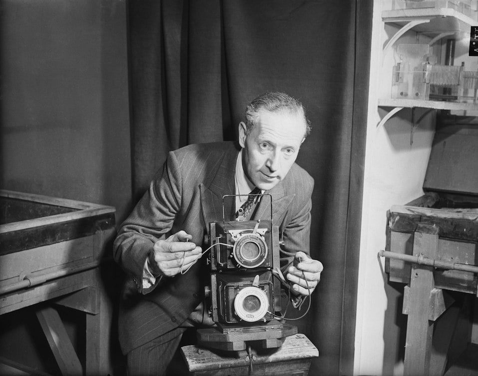 Fox Photos photographer Reg Speller with the double camera he will use at the coronation of Queen Elizabeth