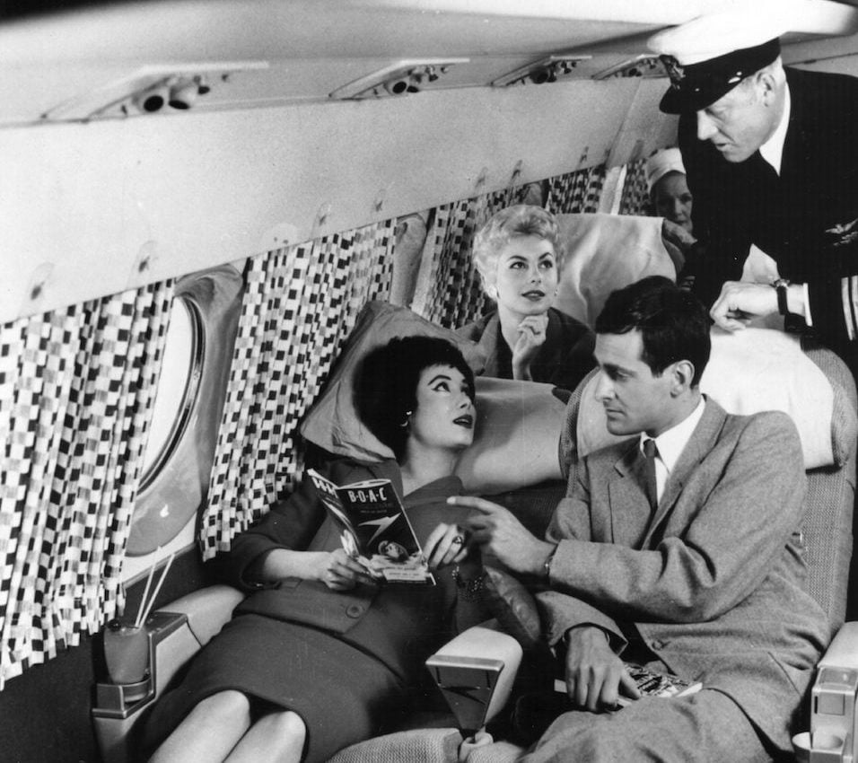 Passengers relaxing on the sleeper seats in the new Comet 4 during a demonstration flight at Hatfield