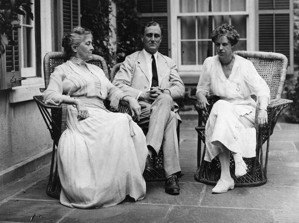 Franklin Delano Roosevelt the Democratic nominee for Vice-President, sits with his wife and mother at their home in Hyde Park,