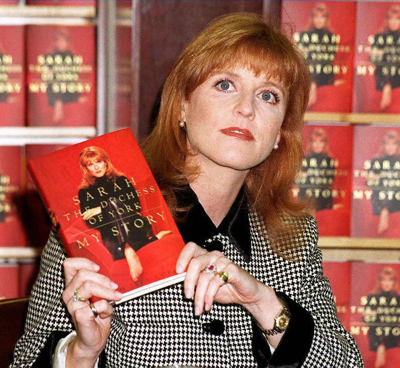 Sarah Ferguson, the Duchess of York, holds up a co