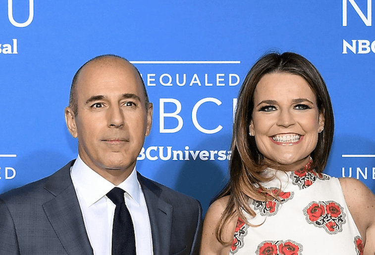Savanah Guthrie and Matt Lauer smiling on a red carpet. Savanah Guthrie and Matt Lauer smiling on a red carpet.