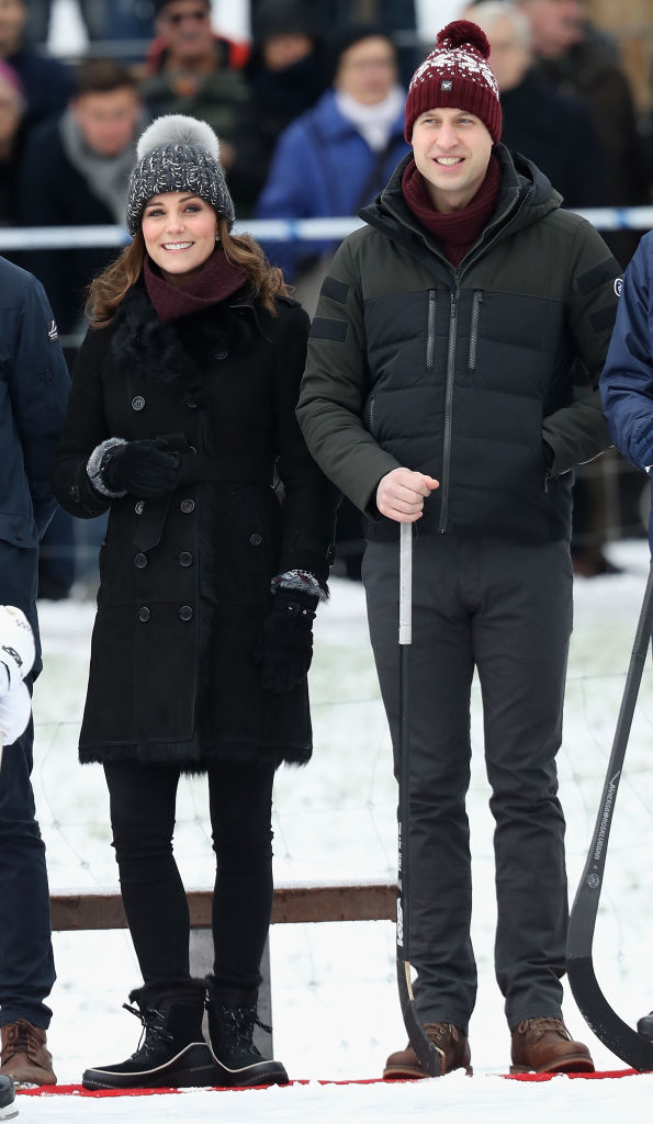 Prince William, Duke of Cambridge and Catherine, Duchess of Cambridge laugh as they attend a Bandy hockey match