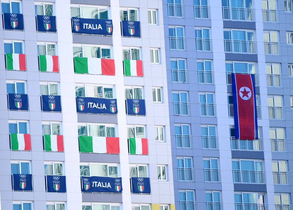 Flags in the windows of the athletes' village in Pyeongchang Olympics