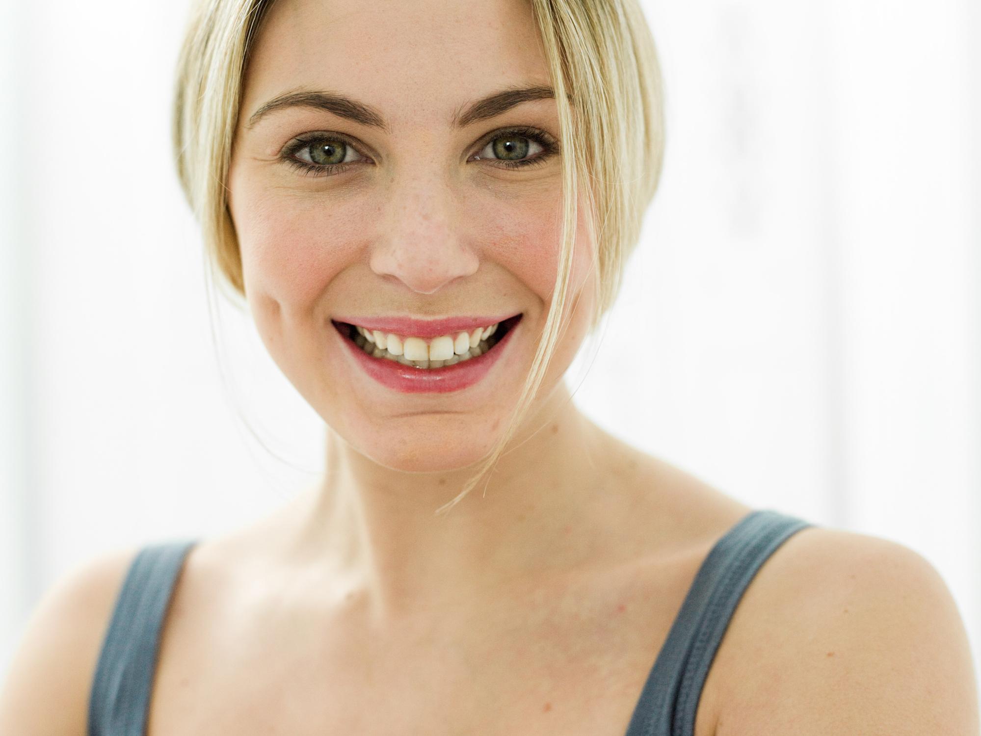 Portrait of young woman with skin dimple
