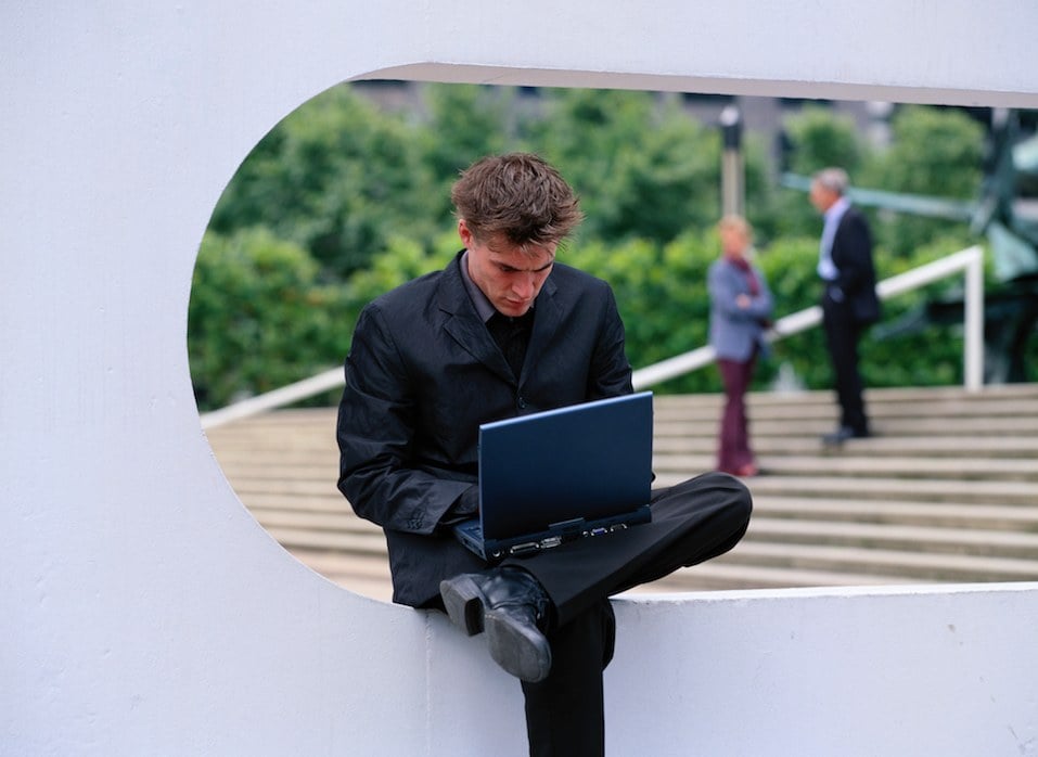 Young Businessman on Laptop Out