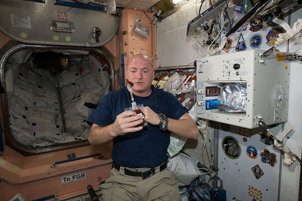 NASA astronaut Scott Kelly enjoys his first drink from the new ISSpresso machine