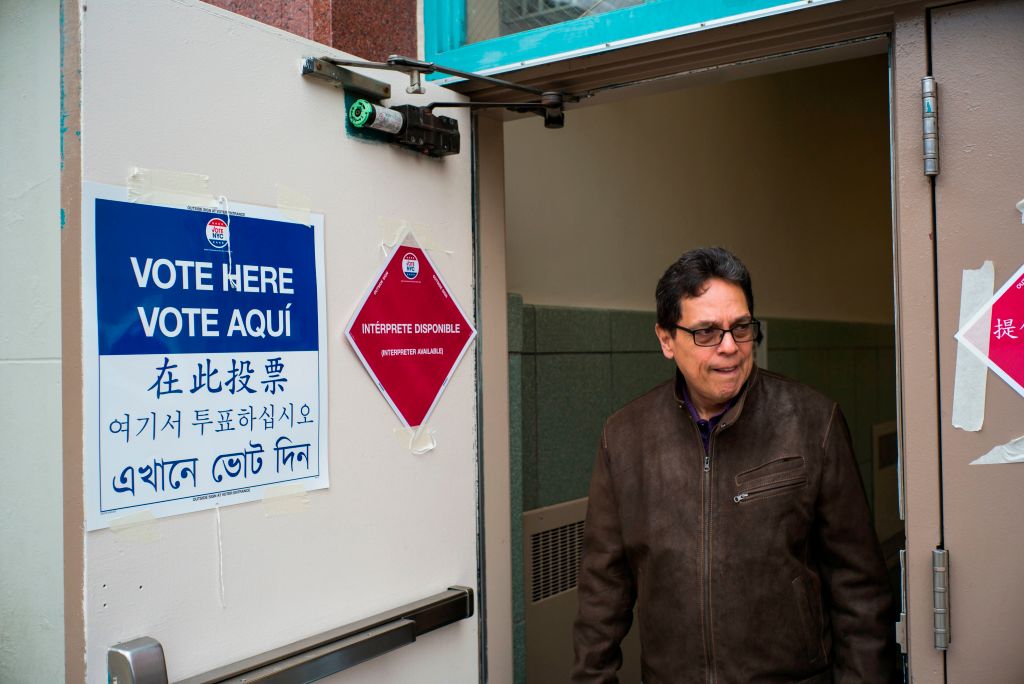A man leaves after casting his vote at a polling station in New York, voter turnout