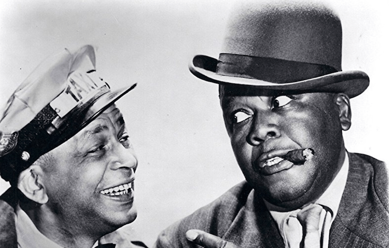 Two men smiling and looking at each other. Two men smiling and looking at each other.