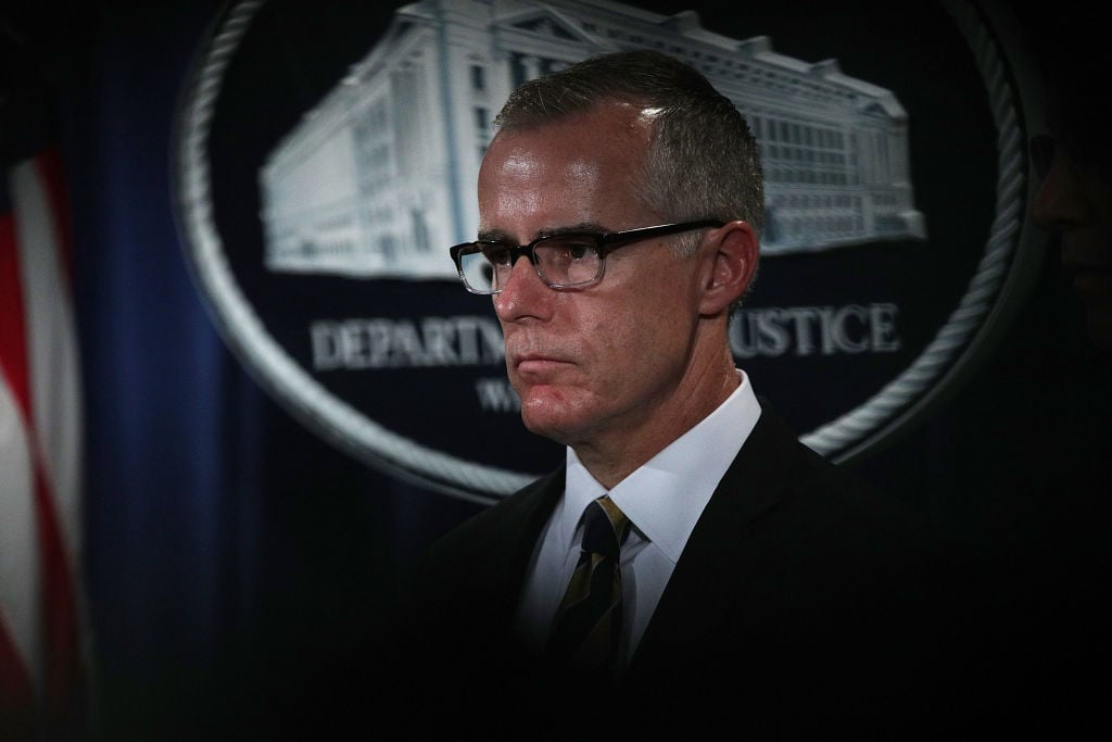 Acting FBI Director Andrew McCabe listens during a news conference Acting FBI Director Andrew McCabe listens during a news conference